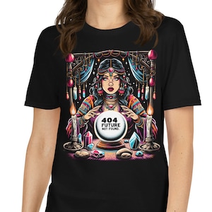 May include: Black t-shirt with a vibrant graphic of a fortune teller and crystal ball. The design includes the text "404 FUTURE NOT FOUND". The artwork features candles, gems, and decorative details, creating a mystical aesthetic.