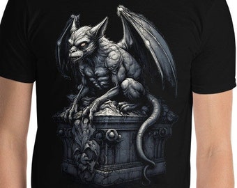 May include: A black t-shirt with a graphic print of a gray gargoyle sitting on a stone pedestal. The gargoyle has wings and a menacing expression.