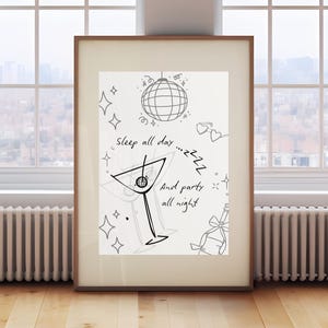 May include: Black and white illustration of a martini glass with a cherry, a disco ball, and the text "Sleep all day... and party all night".