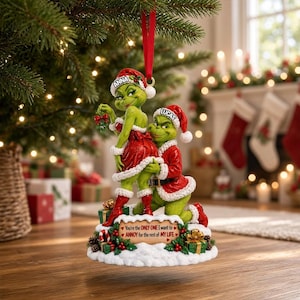 May include: A Christmas ornament featuring two green characters in red and white Santa outfits. One character wears a hat labelled ANNA, the other LUCAS. A sign reads: You're the ONLY ONE I want to ANNOY for the rest of MY LIFE, with small red hearts.
