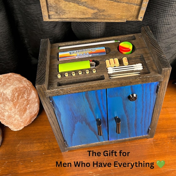A handmade wooden cabinet with a hidden interior organizer — the 'stash box' that looks like tasteful home furniture until you open it.