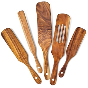 May include: Set of five wooden kitchen spatulas with different shapes and sizes. The spatulas are made of natural wood and have a smooth finish.