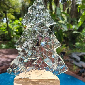 Christmas tree lighted glass decoration.