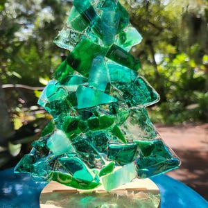 Christmas tree lighted glass decoration.