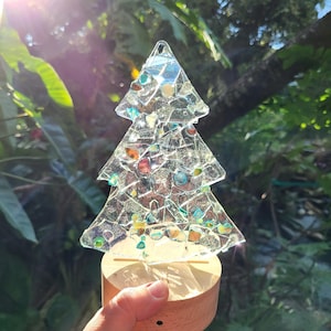 Christmas tree lighted glass decoration.