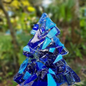 Christmas tree lighted glass decoration.