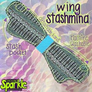 May include: A black and white patterned stashmina with a turquoise band and a stash pocket. The text "wing stashmina" is displayed in purple, with "Machine Washable" in white. The product is from "Spreading Sparkle".