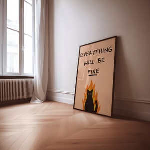 May include: A black framed poster with a pink background and a black cat with yellow eyes sitting in flames. The text on the poster reads "Everything will be fine."