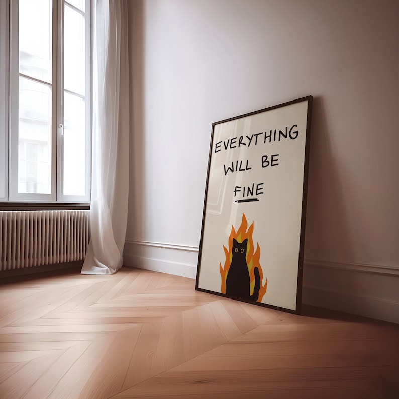 May include: A black framed poster with a black cat in flames and the text "EVERYTHING WILL BE FINE" in black handwriting.