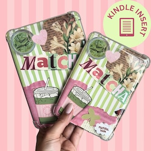May include: Two clear Kindle cases with a green and white striped design. Each case features a matcha drink illustration, the word "Matcha", and floral accents. The cases are decorated with paper cutouts and a pink heart.