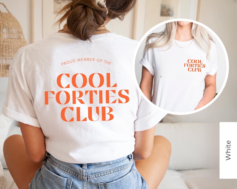 May include: White t-shirt with the text "Proud Member of the Cool Forties Club" printed in orange on the back. The front of the shirt has the text "Cool Forties Club" printed in orange.
