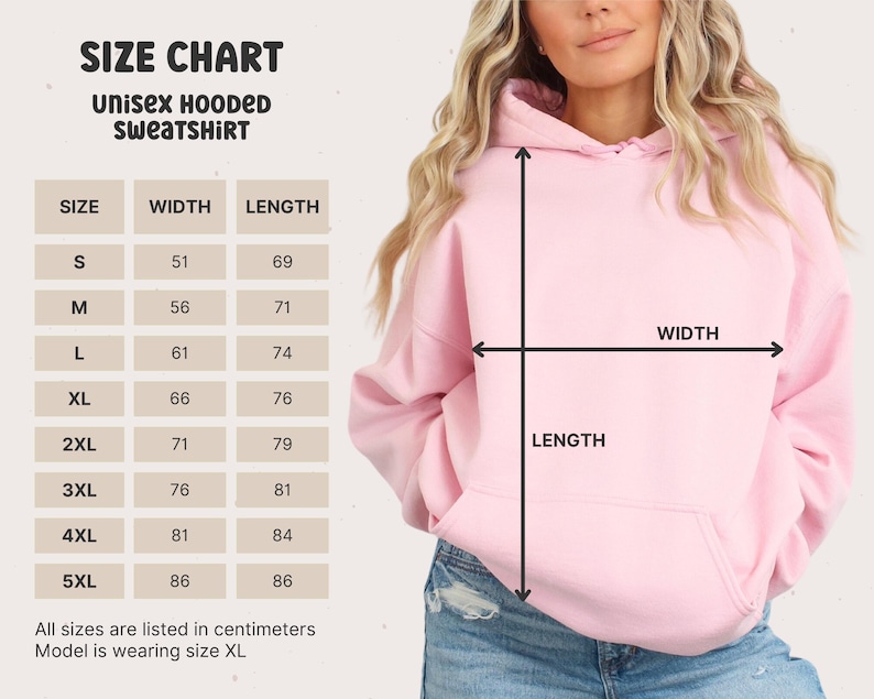 May include: Size chart for a unisex hooded sweatshirt. The chart shows the width and length measurements in centimeters for sizes S through 5XL. A model is wearing a pink hooded sweatshirt in size XL.