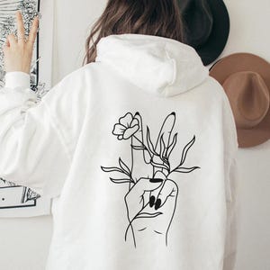 Hoodie mit Friedenszeichen, kuscheliger Kapuzenpulli mit Blumen, Damen Pullover mit Spruch Be Kind, Boho Hippie Backprint, Geschenk für Sie