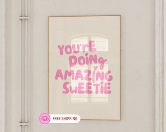 May include: A beige poster with pink text that reads "You're doing amazing sweetie" with a small pink heart above the word "amazing".