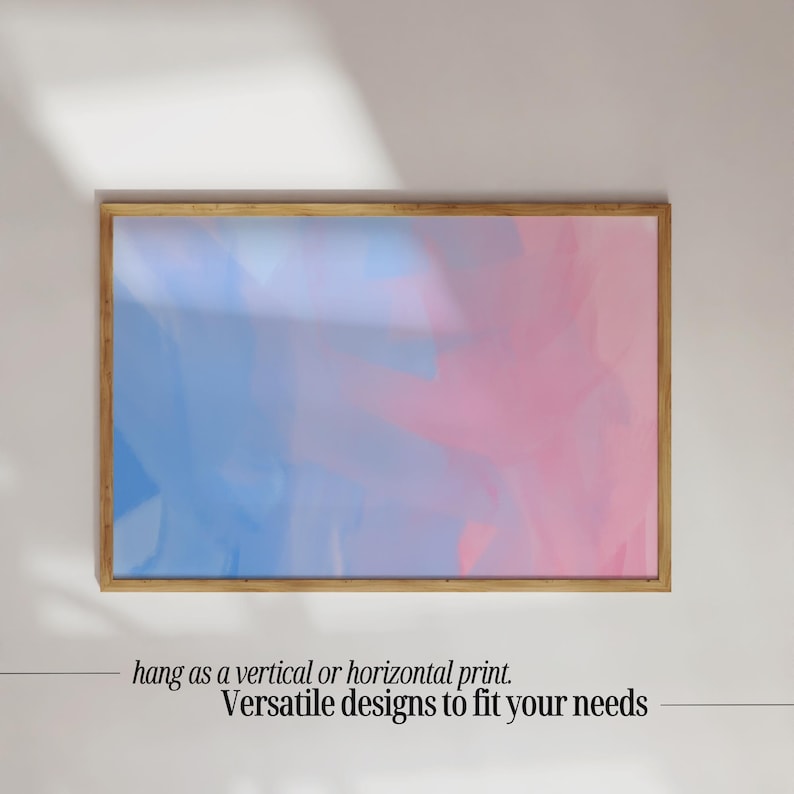 May include: A framed abstract print with a blue and pink watercolor design. The print is in a wooden frame and can be hung vertically or horizontally.