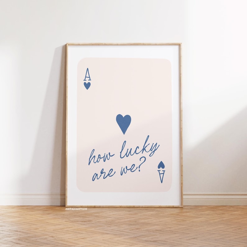 May include: A printable poster featuring a stylized illustration of an ace of hearts playing card with the text "how lucky are we?" in blue script.