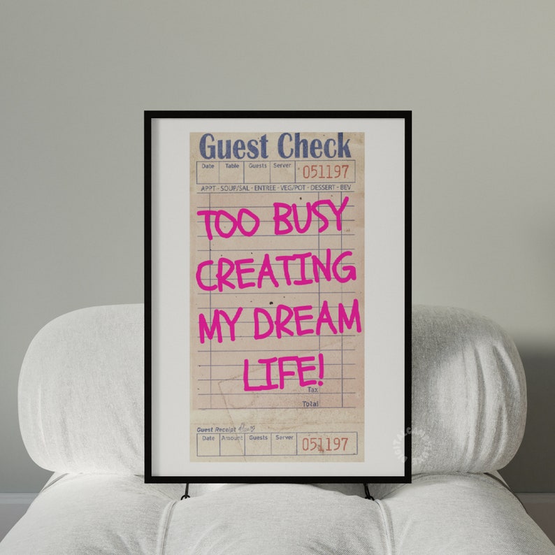 May include: A framed print of a vintage guest check with the text "TOO BUSY CREATING MY DREAM LIFE!" in pink lettering.
