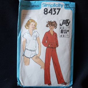 May include: Simplicity sewing pattern number 8437 for a Jiffy easy-to-sew outfit. The pattern includes instructions for a white short-sleeved top with a collar and a red long-sleeved top with a zipper and matching trousers. The pattern is for sizes 13/14, 15/16, and Junior/Teen.