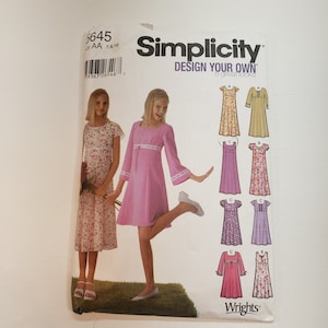 May include: Simplicity sewing pattern number 3645 for girls' dresses in sizes 7, 8, 10. The pattern includes eight different dress styles, including a pink dress with white trim, a yellow dress with white trim, a purple dress with white trim, and a floral print dress. The pattern is titled "Design Your Own 8 Great Looks".