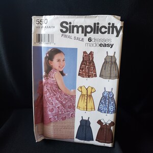 May include: Simplicity sewing pattern 5500 for 6 easy-to-make dresses. The pattern is for sizes 4, 5, 6, 7, and 8. The pattern includes a variety of styles, including a sleeveless dress with a bow, a dress with short sleeves, and a dress with long sleeves.