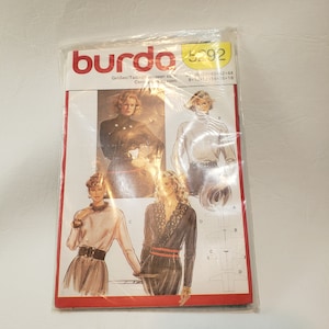 May include: Burda sewing pattern number 8292 for sizes 36-38-40+12+44 and 8+10+12+14+16+18. The pattern includes instructions for making a blouse with a variety of neckline and sleeve options.