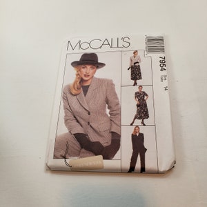 May include: McCall's sewing pattern number 7954, size 14, for a women's suit with a jacket, pants, and a dress. The pattern is for Jones New York.