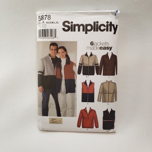 May include: Simplicity sewing pattern number 5878 for 6 jackets. The pattern includes instructions for making a variety of jackets, including a vest, a zip-up jacket, and a bomber jacket. The pattern is designed for sizes XS, S, M, L, and XL.