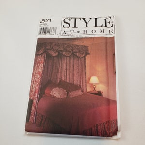 May include: A sewing pattern for a canopy bed with a red and white floral print. The pattern is from Style at Home and the pattern number is 2521.