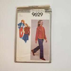 May include: Vintage Simplicity pattern 9629 for girls' clothing. The pattern envelope features illustrations of a red quilted jacket with yellow trim, blue jeans, and other outfits. The envelope is slightly worn.