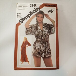 May include: Simplicity sewing pattern number 5545 for a Jiffy pattern. The pattern is for a medium size, 14-16, and is for a miss or young woman. The pattern shows a woman wearing a brown and white patterned short-sleeved dress with a belt.