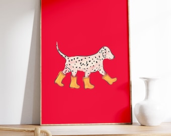 May include: A framed illustration of a Dalmatian dog wearing yellow rain boots on a bright red background.