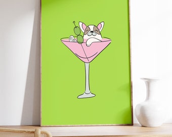 Puede incluir: Una impresión enmarcada verde de un perro de dibujos animados relajándose en una copa de martini rosa con aceitunas verdes.
