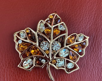 Vintage Nolan Miller Autumn leaf pin. Gold tone with faceted crystals brooch. Signed maple leaf pin.