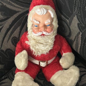 Vintage Rushton plush Santa with rubber face, blue eyes. Circa 1950’s.
