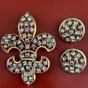 Stunning Vintage Lisner Fleur De Lis rhinestone brooch and matching clip on earrings set. Signed.