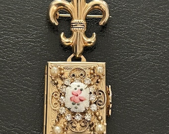 Vintage Coro Pegasus photo locket with Fleur de Lis brooch. Guilloche, rhinestones & faux pearls. Signed.