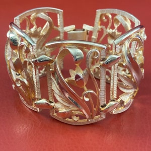 Vintage Judy Lee gold wide cutout flower bracelet. From the 1950’s. Signed.
