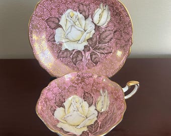 Rare Paragon floating yellow rose HM Queen Mary mauve and gold fine bone china teacup and saucer.