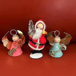 Vintage Putz paper mache Santa and 2 Angel cardboard and pipe cleaner  ornaments with instruments. From the 1950’s stamped Japan.