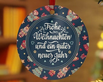 May include: Round Christmas ornament with a blue background and a white border. The ornament features a festive design with colorful illustrations of Christmas trees, stars, and presents. The text "Frohe Weihnachten und ein gutes neues Jahr" is written in white lettering.