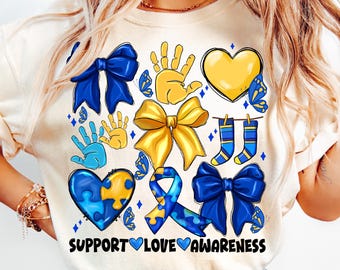 May include: A white t-shirt with a blue and yellow design featuring handprints, butterflies, hearts, ribbons, socks, and a puzzle piece. The text "SUPPORT LOVE AWARENESS" is printed on the bottom of the shirt.