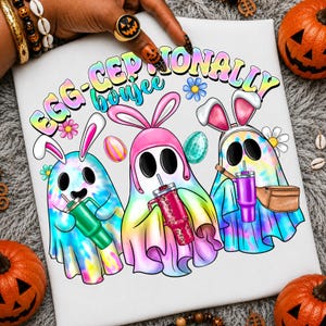 May include: A white fabric surface featuring a colorful graphic of three tie-dye ghosts wearing bunny ears. The ghosts hold tumblers and one wears a fanny pack. The text reads EGG-CEP-TIONALLY boujee. The design includes small flowers and Easter eggs.