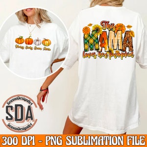May include: White t-shirt with a sublimation design featuring a pumpkin theme. The design includes the text "This Mama loves her pumpkin" with a plaid, leopard, and sunflower pattern. The front of the shirt has four pumpkins with the names "Hery, Emily, Emma, Anna" written below.