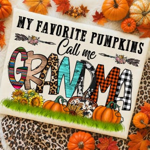 May include: A white t-shirt featuring the text MY FAVORITE PUMPKINS Call me GRANDMA. The word GRANDMA is styled with various patterns including leopard print, plaid, and wood grain. The design includes sunflowers, pumpkins, and arrows.