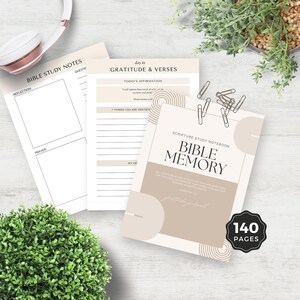 May include: A beige and brown Bible memory notebook with a geometric design. The notebook has 140 pages and the text "Scripture Study Notebook Bible Memory" is printed on the cover. The text "All Scripture is breathed out by God and profitable for teaching, for reproof, for correction, and for training in righteousness" is also printed on the cover.