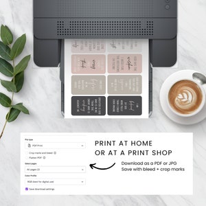 May include: A computer screen displaying a printable design of inspirational quotes. The quotes are in a minimalist style with a black and white color scheme. The screen shows a preview of the design and a menu for selecting file type, pages, and color profile. The text on the screen reads "PRINT AT HOME OR AT A PRINT SHOP Download as a PDF or JPG Save with bleed + crop marks".