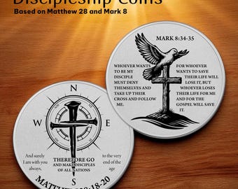 May include: Two silver-colored Discipleship Coins with religious text from Matthew 28:18-20 and Mark 8:34-35. One coin features a compass rose with a cross and nail design. The other coin has a dove above a cross.