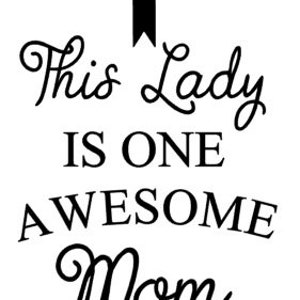 May include: A white background with black text and a black arrow pointing upwards. The text reads "This Lady IS ONE AWESOME Mom" in a mix of cursive and block letters. A gift for Mother's Day.