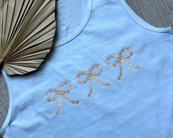 Embroidered Seashell Cowrie Bow Comfort Colors Tank Top: white shirt with gold thread