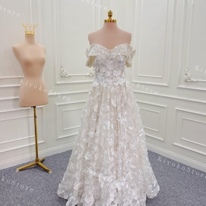 3d flower A-line wedding dress. Formal wedding dress. Midi wedding dress. Off the shoulder wedding dress.